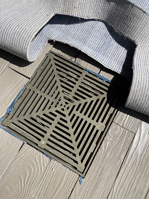 Testing the area cut on rug to accommodate water drain